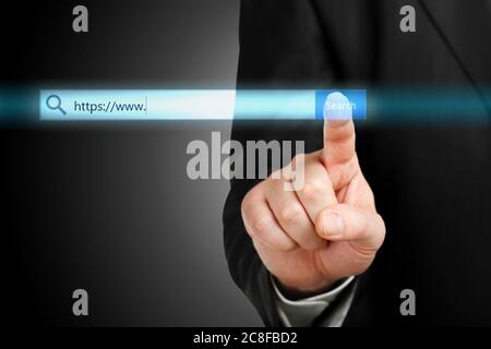 male hand pressing an internet search bar, internet concept Stock Photo