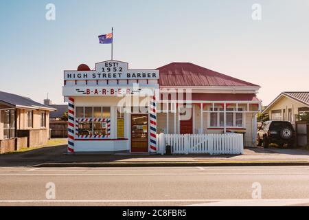 1950s style High Street Barber shop in Greymouth, New Zealand Stock Photo