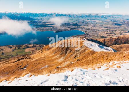 Wanaka township and Lake Wanaka, as seen from a snowy Roys Peak, New Zealand Stock Photo