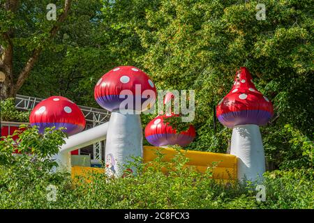 Jumping castle with corner towers formed as mushrooms. Stock Photo