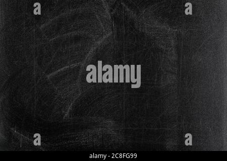 rubbed out chalk on black chalkboard Stock Photo
