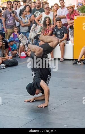 Street dancer performing during action sports festival in Vigo in the province of Pontevedra (Spain), part of the autonomous community of Galicia. Stock Photo