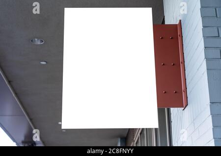 Rectangular white company sign mockup on a brick wall. Stock Photo