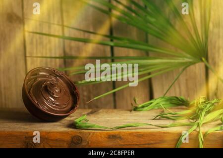 Homemade chocolate spread. Chocolate paste in a bowl. Chocolate cream on wooden table. Stock Photo