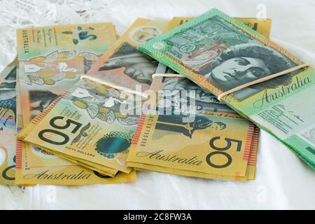 Piles of Australian currency fifty and one hundred dollar notes Stock Photo