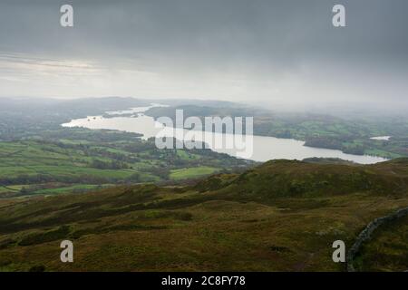 A misty autumnal view of Lake Windermere from the summit of Wansfell in the Lake District National Park, Cumbria, England. Stock Photo