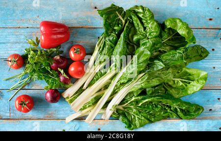 Mangel,chard,Beta vulgaris,common beet and organic vegetables,healthy food, flat lay on kitchen board,good copy space Stock Photo