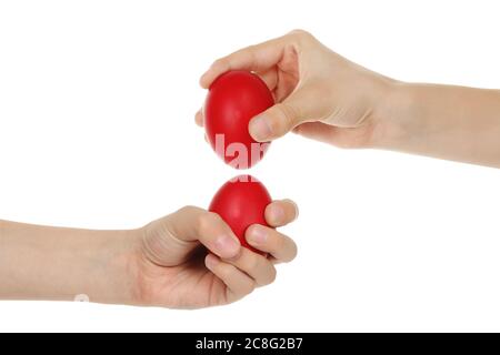 hands with red easter eggs isolated on white Stock Photo