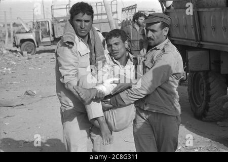 Israel. 06th July, 2020. Egyptian soldiers carry an injured comrade who was discovered in a bunker during the Yom Kippur war, the Yom Kippur war between Israel and the Arab states of Egypt, Jordan and Syria lasted from October 6 to October 25, 1973, Â | usage worldwide Credit: dpa/Alamy Live News Stock Photo