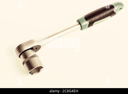 Steel chrome plated highly polished durable for long time use. Useful tools concept. Auto repair shops. Knob for socket wrench nut ratchet close up white background. Ratchet wrench. Ratchet tool. Stock Photo