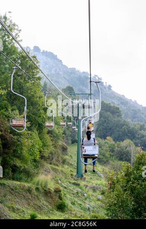 People use chairlifts to get to the summit of Monte Solaro which is the highest point of the Island of Capri  in the Bay of Naples Stock Photo