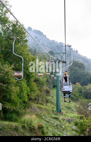 People use chairlifts to get to the summit of Monte Solaro which is the highest point of the Island of Capri  in the Bay of Naples Stock Photo