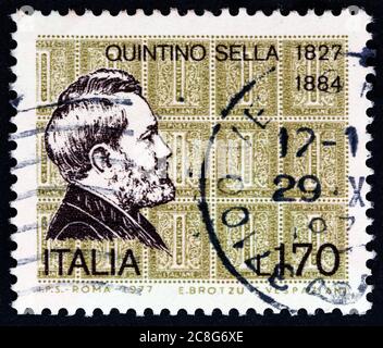 ITALY - CIRCA 1977: A stamp printed in Italy from the issued for the 150th birth anniversary of Quintino Sella shows Quintino Sella and 1863 stamps. Stock Photo