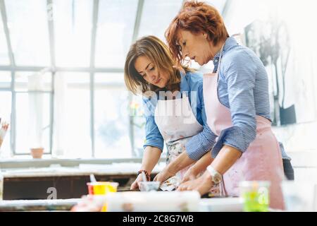 Two women working in creative studio Stock Photo