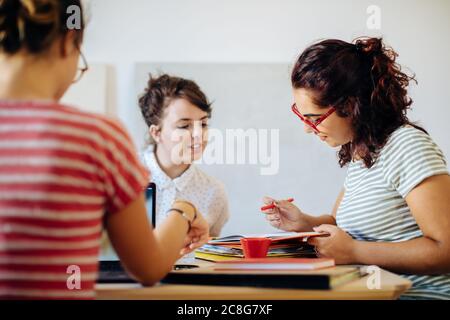 Colleagues discussing documents Stock Photo