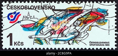 CZECHOSLOVAKIA - CIRCA 1985: A stamp printed in Czechoslovakia from the 'National Spartakiad' issue shows Gymnasts performing with ribbons. Stock Photo