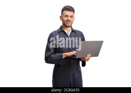 Auto mechanic worker holding a laptop computer and looking at the camera isolated on white background Stock Photo