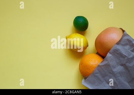 juicy ripe citrus fruits in an eco-friendly shopping bag Stock Photo