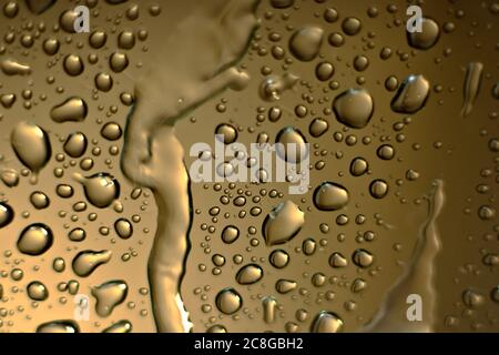 Water droplets on a golden background Stock Photo