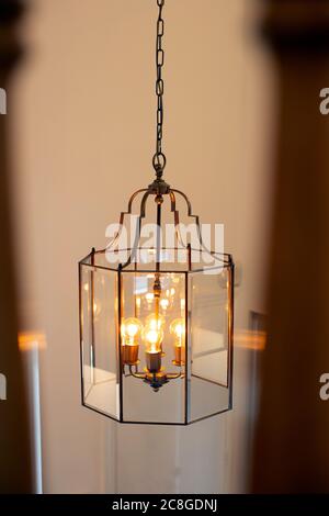 Chrystal chandelier close-up, light decor with light bulbs modern design beautiful home decoration Stock Photo
