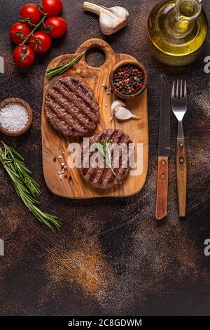 Fried cutlet for burger on a wooden board, top view, copy space. Stock Photo