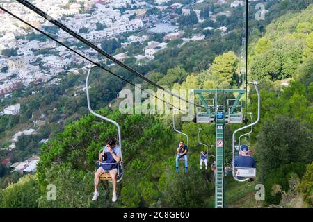 People use chairlifts to get to the summit of Monte Solaro which is the highest point of the Island of Capri  in the Bay of Naples Stock Photo