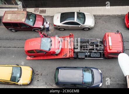 Car being loaded onto breakdown truck. Stock Photo