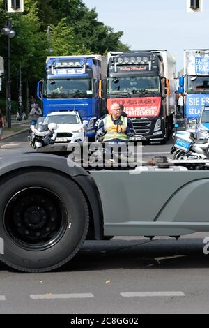 Berlin, Germany - Friday 24th July 2020 - Lorry drivers bring traffic to a halt in the centre of Berlin as they protest about the impact of the Coronavirus crisis on the lack of business for road hauliers and price under cutting. Roads were blocked for about 30 minutes as several hundred lorries came to the centre of the city. Photo Steven May / Alamy Live News Stock Photo