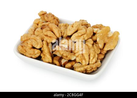 bowl of shelled walnuts isolated on white Stock Photo