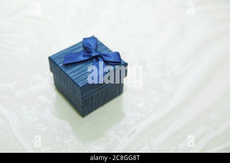 Rectangular ring box . blue jewelry gift box . Marriage proposal concept . Blue ring box . Stock Photo