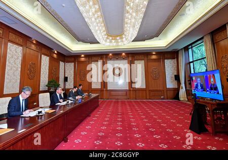 Beijing, China. 24th July, 2020. Chinese State Councilor and Foreign Minister Wang Yi holds talks with German Foreign Minister Heiko Maas via video link in Beijing, capital of China, July 24, 2020. Credit: Yue Yuewei/Xinhua/Alamy Live News Stock Photo