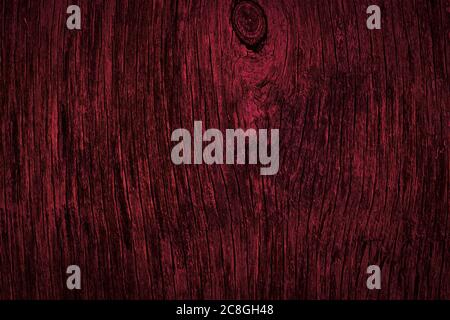 Dark burgundy wood texture. Texture of old dried plywood. Mahogany background for design. Stock Photo