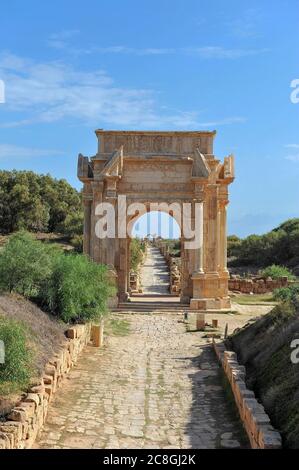 Historical street with the triumphal arch of Septimius Severus, ruined city of Leptis Magna, Libya Stock Photo