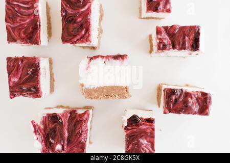 strawberry cheesecake cut up into squares Stock Photo
