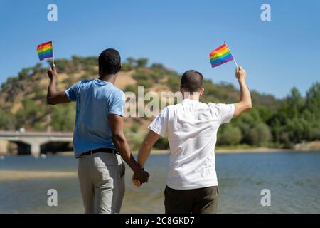 gay couple enjoying a day on the river Stock Photo