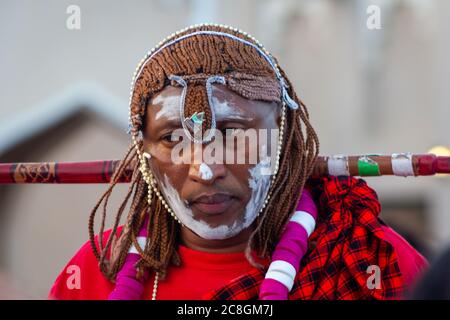 Portrait of African man wearing Traditional tribe costume with blurred background shot taken during African festival in Katara cultural village Doha Stock Photo