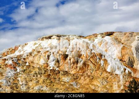 The travertine terraces of Mammoth Hot Springs inYellowstone National Park, Wyoming. Stock Photo