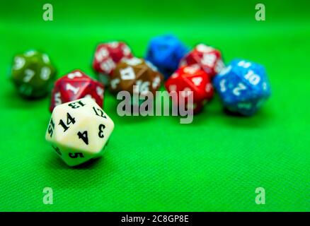 Green board with several colored role-playing dice Stock Photo