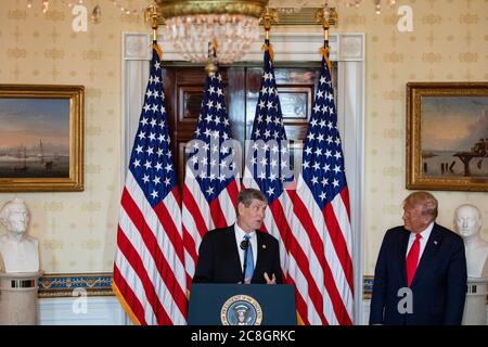 Former United States Representative Jim Ryun (Republican of Kansas), left, makes remarks during the ceremony where he accepted the Presidential Medal of Freedom in the Blue Room of the White House in Washington, DC on July 24, 2020. Looking on from right is US President Donald J. Trump. Ryun won a silver medal in the 1500 m at the 1968 Summer Olympic games in Mexico City Credit: Samuel Corum/Pool via CNP | usage worldwide Stock Photo