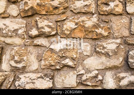 The texture of the old stones wall as a background. Stock Photo