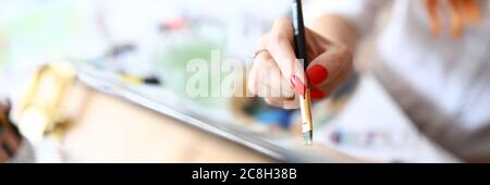 Female hand with red nails Stock Photo