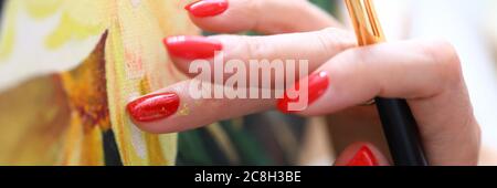 Talented woman with red nails Stock Photo