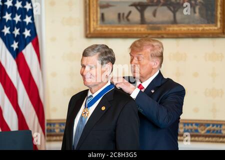 Washington, United States Of America. 24th July, 2020. Washington, United States of America. 24 July, 2020. U.S. President Donald Trump presents Olympic Silver Medalist and former U.S. Representative Jim Ryun with the Presidential Medal of Freedom in the Blue Room of the White House July 24, 2020 in Washington, DC Credit: Joyce Boghosian/White House Photo/Alamy Live News Stock Photo