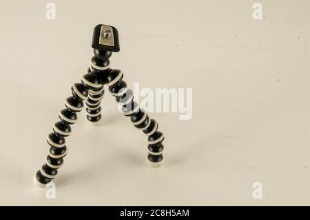 Mini table flexible tripod on white background Stock Photo