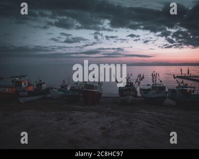 fishing boats at the beach of the Baltic Sea shortly befor sunrise