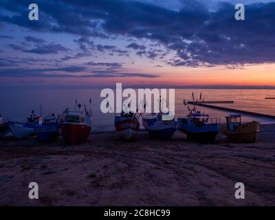 fishing boats at the beach of the Baltic Sea shortly befor sunrise