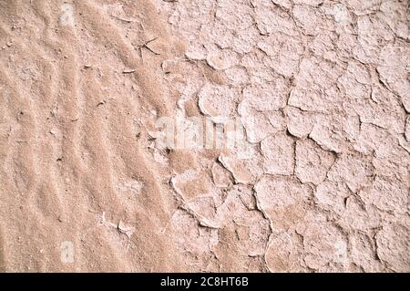 Dry, parched and cracked white mud patterns in the eastern desert of the Badia region, Wadi Dahek, Hashemite Kingdom of Jordan. Stock Photo