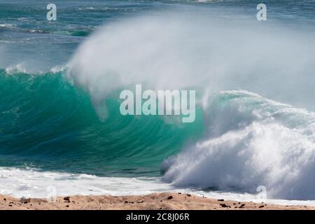 View of wave breaking on beach, Georgetown, Ascension Island, mid-Atlantic Ocean 23rd April 2018 Stock Photo
