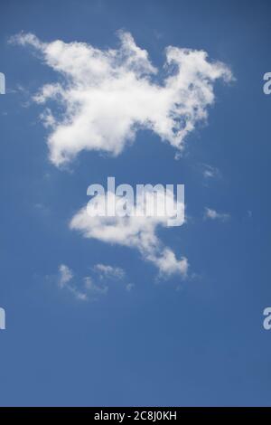Puffy clouds against a blue sky Stock Photo