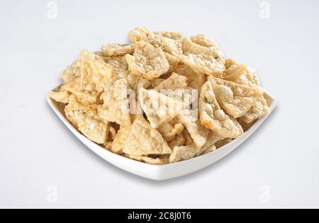 Deep fried Khichiya Papad, Traditional Indian Snacks, Indian crunchy fried snack papad or Papadam made of rice floor served in a plate. Also known as Stock Photo